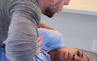 Chiropractor in Los Angeles performing an adjustment on first time patient with Testimonals